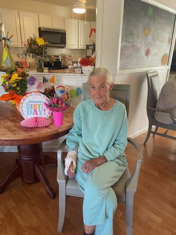 An elderly woman in a chair