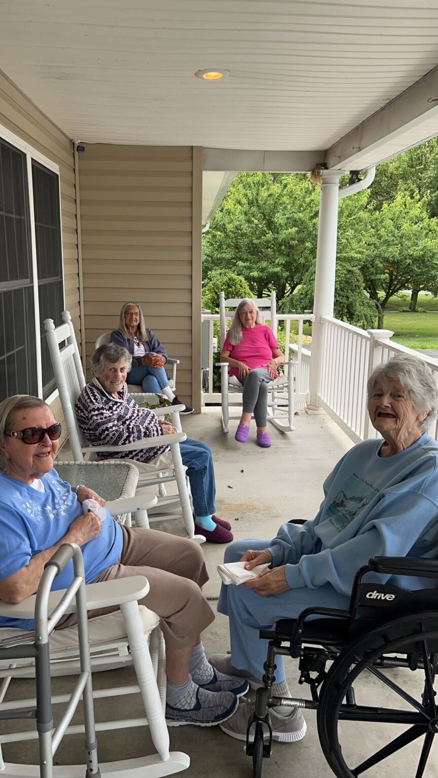 Elderly people relaxing on a porch