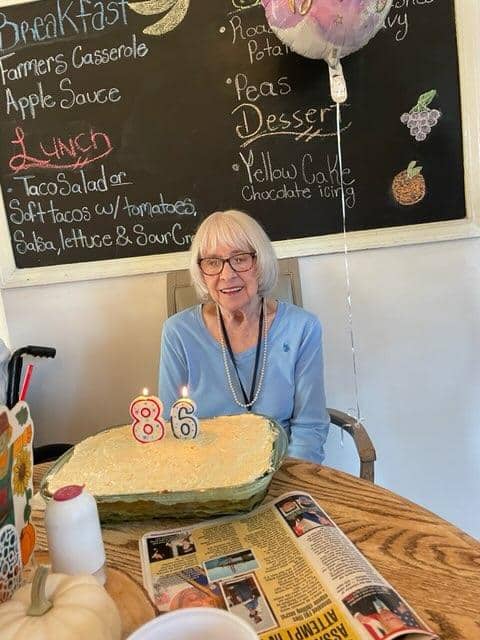 An older woman celebrating her 86 birthday